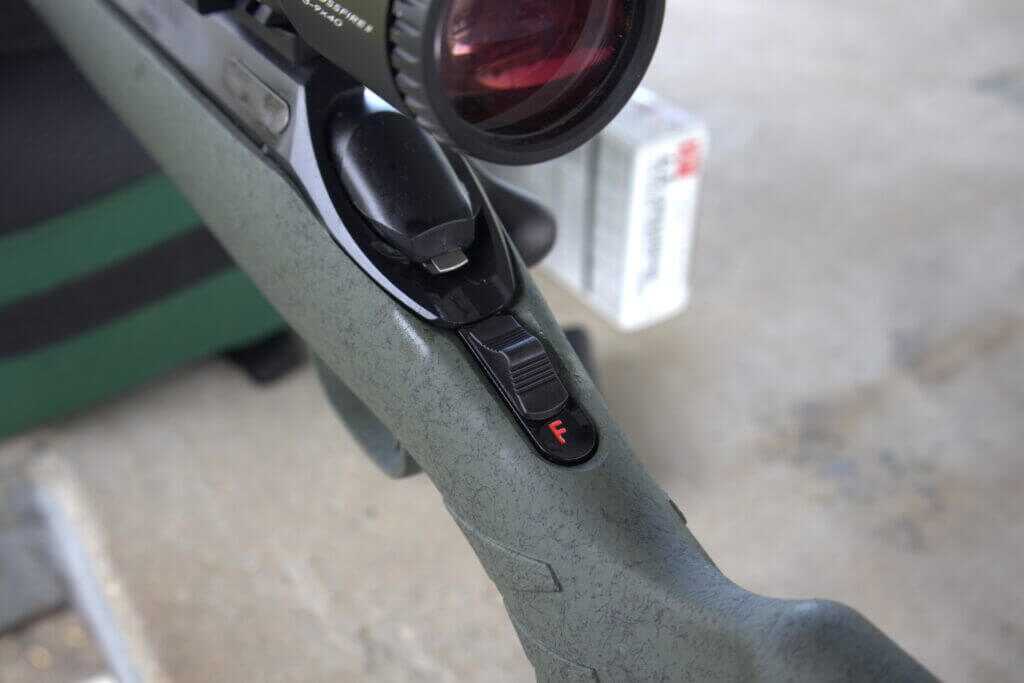 Glenfield Model A ambidextrous sliding safety behind the bolt striker
