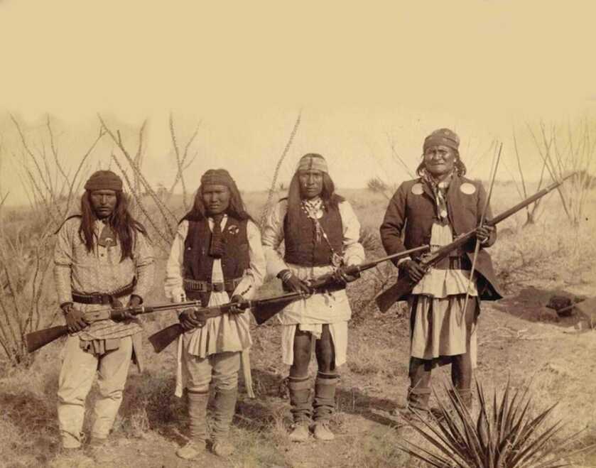 Geronimo and his Apache family with rifles including Winchester Model 1873 rifles