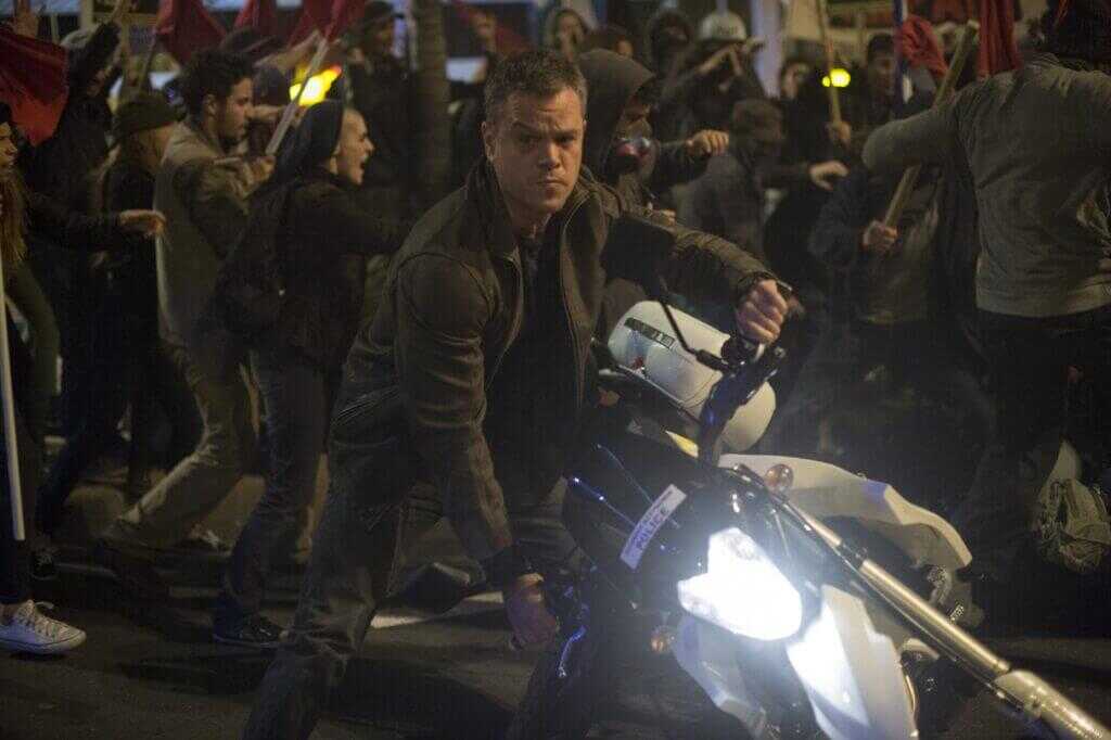 Jason Bourne motorcycle chase movie still contrasting Hollywood action with the Ray Davis Lahore incident