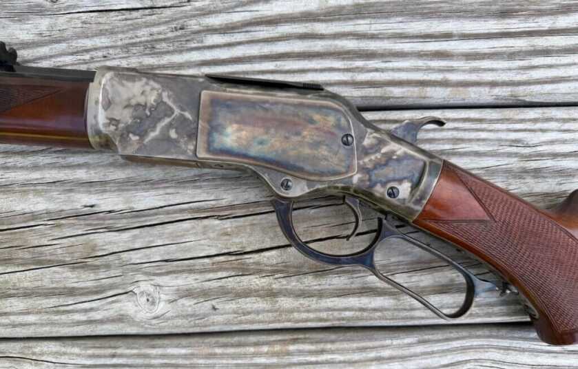 Uberti 1873 Sporting Rifle left-side receiver showing the classic steel-frame Winchester 1873 design