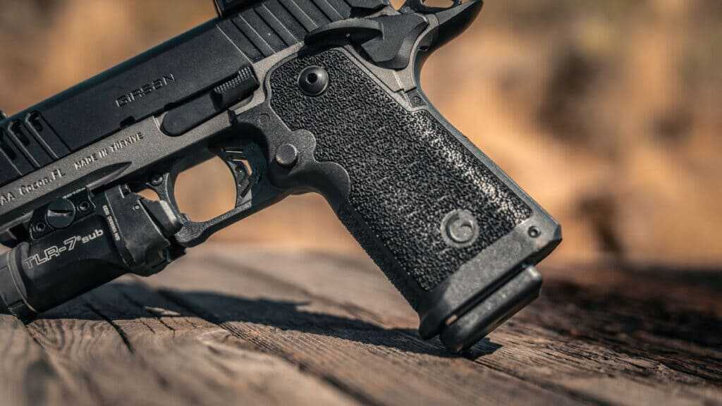 Girsan Witness2311 CMX XXX grip showing internal firing-pin safety design without traditional grip safety