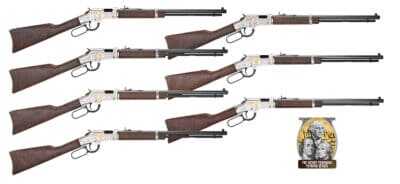 Seven Henry Golden Boy Silver tribute rifles with walnut stocks and engraved silver-colored receivers, arranged on a white background.