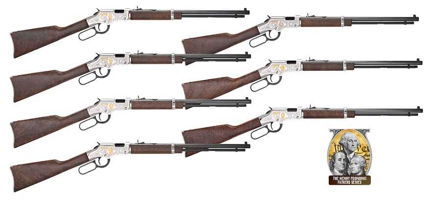 Seven Henry Golden Boy Silver tribute rifles with walnut stocks and engraved silver-colored receivers, arranged on a white background.