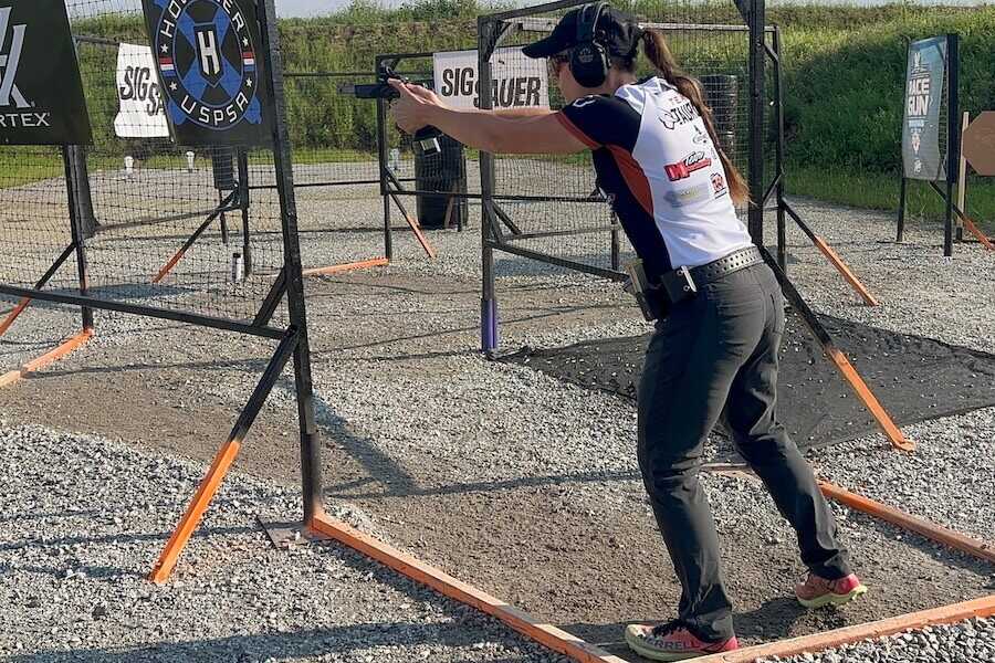 Jessie Harrison fires an Open Division pistol while competing on a USPSA stage.