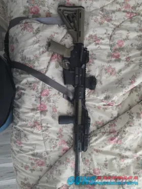 AR-15 Carbine with red dot and weapon li...
