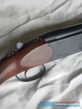 Beretta over/under shotgun with blued ba...