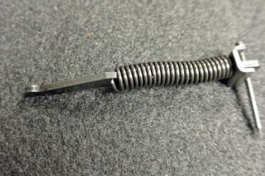 The hammer strut and mainspring.