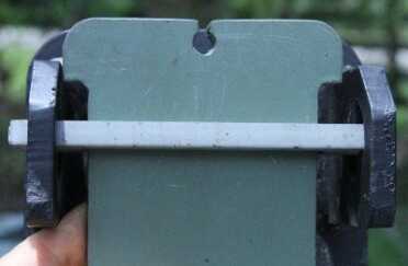 The swinging plates drop into slotted crossbars. There is no hardware on the target itself, just steel plates.