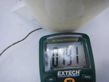 We measured the heater under the bag on a plastic table and it held at almost 200 degrees. 