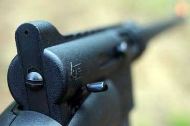 The rear sight has two pin holes (one smaller than the other). It may not look like much, but it works. 