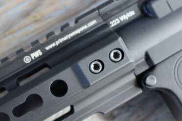 The forend bolts in place securely and covers the gas system so well that you wouldn't know it was there. 