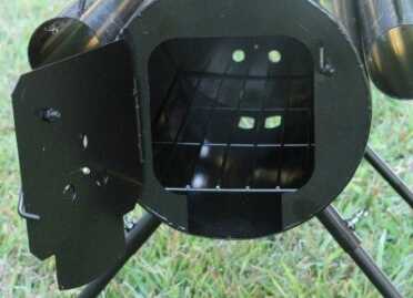 Prepping 101: The 0 Survival Woodstove There is a nice cleanout built into the stove, and as you can see, the rear has ventilation holes, as does the bottom, so you can really control the burn even without gaskets.