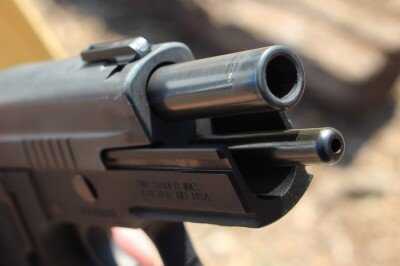SIG P226 TacOps tilting barrel shown partially unlocked