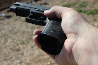 Flared SIG P226 TacOps grip guiding magazine during reload