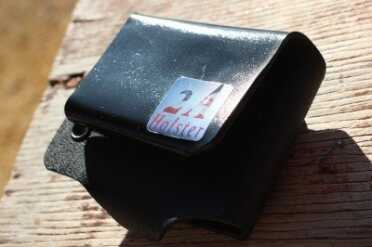 The smooth back of the mag holder is slightly concave. 
