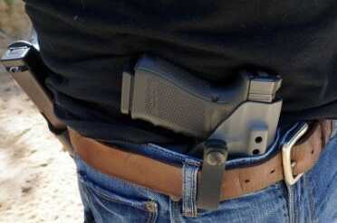 To tuck in the shirt, slide your shirt tail between the belt loop and the Kydex.