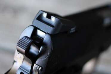 Christensen Arms Custom 1911 Commanders The Trijicon Novack 3-dot sights are solid, but sloped on the back side (which makes one handed operation of the gun unnecessarily complex).