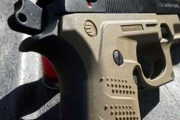 Recover that Beretta m9 The grips screw into place where the old panels were, so there's not to much change in the width.