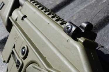 the rear sight sits on the rail.