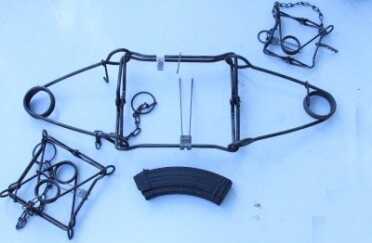 The mainsprings on the traps have to be compressed, and the jaws spread open. 