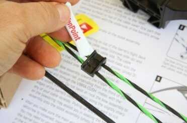 This guide clips to the string and has slots for the higher and lower string. The crossbow comes with this lubricant for it, and it slides in easy. 