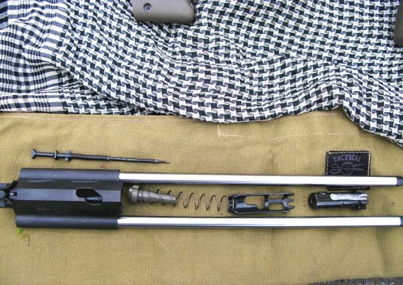 The AUG's bolt carrier group and bolt can be easily disassembled without any tools, perfect for any rifle that may see field use. The parts are also pretty big so there's less chance of losing them.
