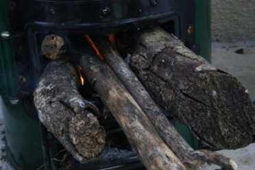 I found that with the StoveTec Rocket Stove it takes a raging fire to keep the water coming. This is old woodpile wood and sticks, but it took about 2 loads of this per hour. 