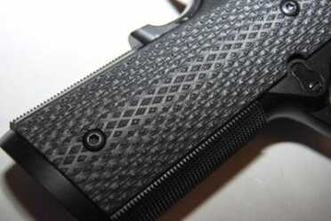 Gun Review: Springfield Armory 1911 TRP The Armory Kote model comes with G10 grips.