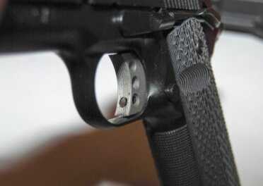 Gun Review: Springfield Armory 1911 TRP The aluminum trigger has an inset overtravel adjustment.