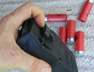 Build an 11 Shot Mossberg 500 - Detachable Mags, No Gunsmith Required! My only real complaint with the system is that I have on several occasions laid a magazine down and nicked the magazine emptying button, which is on all the mags. The shells just flow out onto the ground. I think it should have a stiffer spring so that it is harder to accidentally release.