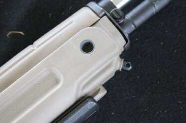 There is still a sling swivel in the front, as well as front and rear ball bearing swivel mounts. The gun doesn't come with those swivels, nor does the original Archangel. 