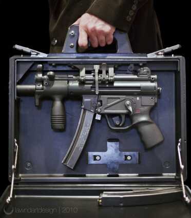 Understanding The HK MP5--Full Auto Review HK Briefcase with K gun installed note trigger on underside of briefcase handle. All rounds were kept in case upon firing. A Business card could be inserted on side of case to cover muzzle. The case itself is considered an AOW in the USA.