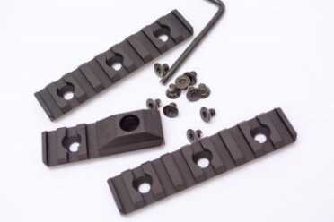 The box contains two rail segments and a sling attachment piece.