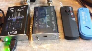 These are the models of basic Software Defined Radio (SDR) I have tried. For the regular dongle, which covers 100mhz-1.7ghz, the blue one seems to be the latest, with an updated tuner chip. The two blocks on the left include an Up Converter to be able to tune below 100mhz, in the HF bands used by Hams.  the only difference between the two seems to be that switch that is absent from the less expensive one but it seems to work just as good without the switch.
