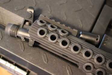 Troy Takes on the AK-47 Rock the forend over the front sight. You will likely need to take off the muzzle device.