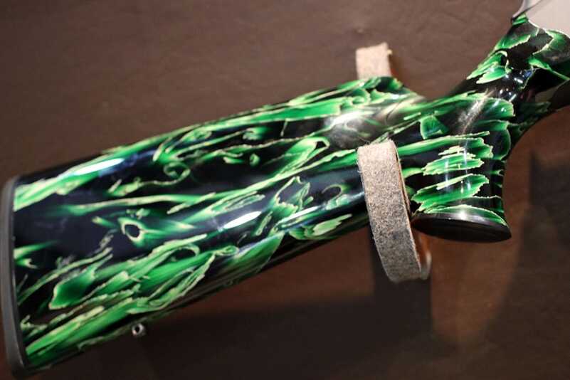 Incredible Colors for the Blaser R8 Rifles -- SHOT Show 2016 This is a clear acylic with a rich green dye and a grass like material that reminded me of dried palmetto fronds.