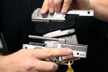 Heizer's New Semi-Auto is the Thinnest Yet--SHOT Show 2016 And the frame slides back on this guide-rod.
