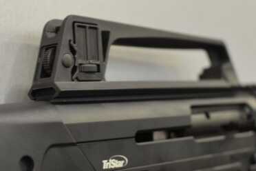 The old school carry handle comes off. 