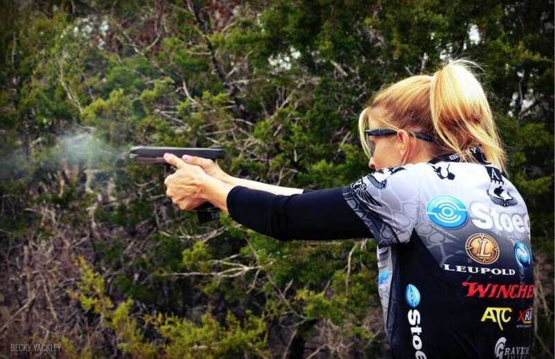 Becky Yackley, the author of the article, shooting USPSA Limited division with a Glock 34.