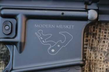 Primary Weapons Systems--Modern Musket Review The logo is smart, and pushes the point home.