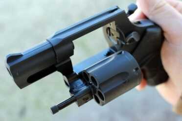The Taurus ejects left, and rotates to the left. 