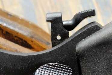 Even if the pin drifts out, everything will stay in place--even through cocking and recoil. The hammer has to be turned over to release.