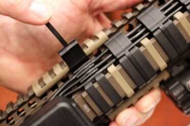 Trigger Activated Lights and Lasers? Trigger Point Technology--SHOT Show 2016 And they've even devised a clasp for keeping the cables organized.