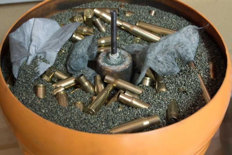 A vibrating tumbler will get your brass clean. The dryer sheets shown here help collect some of the dirt so the cleaning media lasts longer. 