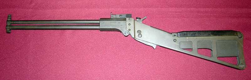 An early M6 without a trigger guard, and with a short set of barrels.