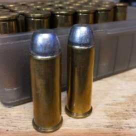 Reloading: Seating and Crimping Bullets These .44 Magnum reloads headspace on the rim so they can use a roll crimp. Note how the case mouth "rolls" into the bullet groove (cannelure.)