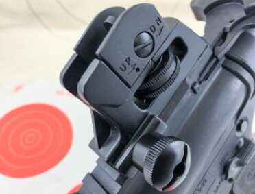 The rear sight is adjustable for windage and elevation.