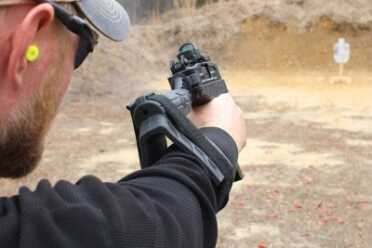 Braced on the arm. At just 4.5 pounds, this is one of the easiest guns to brace like this.