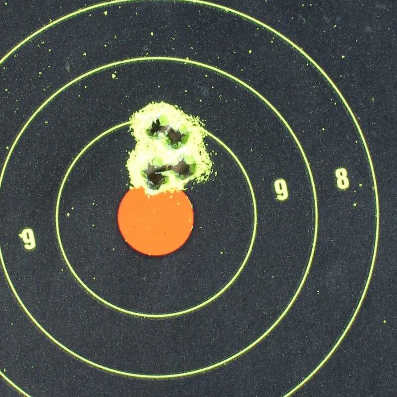 5 rounds of the Remington from 30 feet. Iron sights.