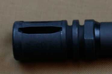 As Close to an M16 as You Can Get: FN's Military Collector Series A2 flash suppressor with crush washer is standard fare